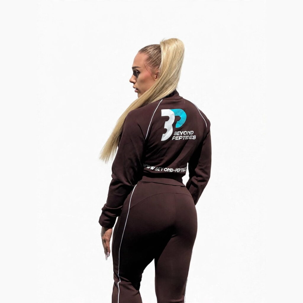 Beyond Peptides women's tracksuit in dark brown, angled back view