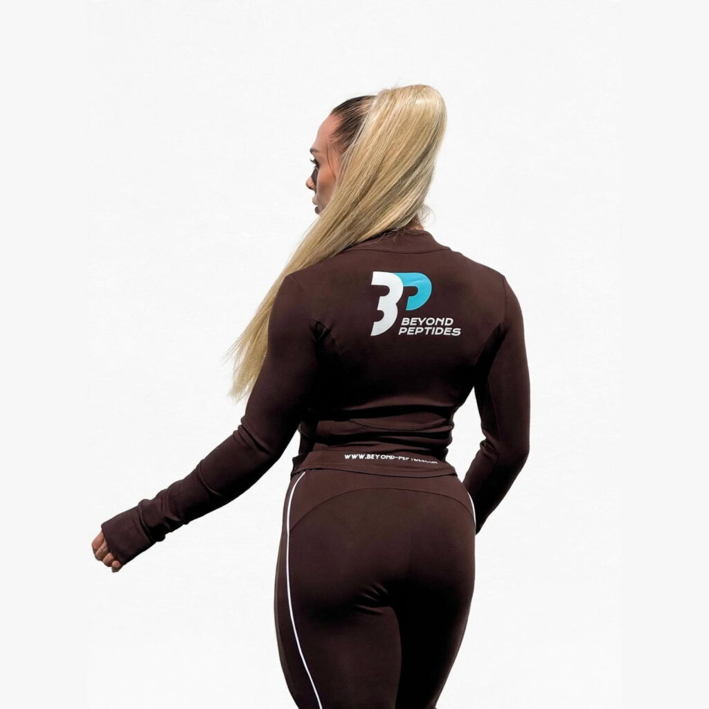 Beyond Peptides women's tracksuit, close view of the back logo and the printed jacket hem
