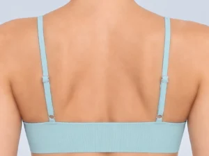 Close-up of the thin straps with sliders and the ribbed back band of the arctic blue Sports Bra