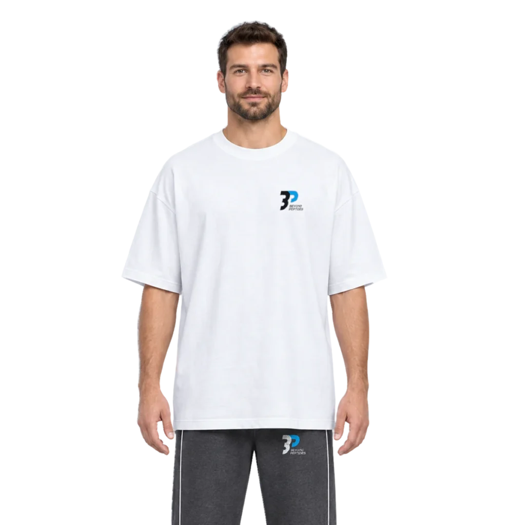Model wearing the White Oversized Tee with the Grey Unisex Jogger, front view