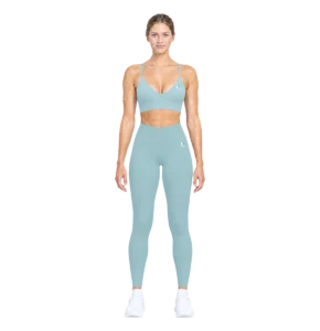 Model wearing the arctic blue Women's Leggings with the matching Sports Bra, full length front view